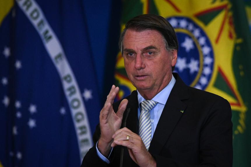 Jair Bolsonaro, Brazil's President, speaks during a ceremony at the Planalto Palace in Brasilia, Brazil, on Wednesday, Feb. 24, 2021. Economy Minister Paulo Guedes joined the Bolsonaro administration in 2019 as a super minister charged with steering Latin America's largest economy, but two years later, it's the president who's increasingly calling the shots and moving away from his star ministers market-friendly agenda. Photographer: Andres Borges/Bloomberg via Getty Images