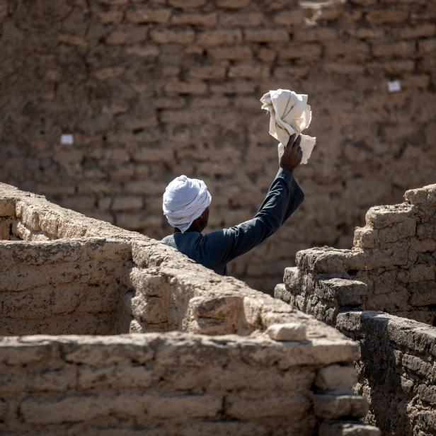 LUXOR, EGYPT - APRIL 10: Workers at the site of a 3000 year-old lost city on April 10, 2021 in Luxor, Egypt. Egyptian archaeologists have discovered Aten or "the lost golden city" which is believed to be the largest ancient city ever discovered in Egypt and one of the most important finds since the discovery of Tutankhamun's tomb. The 3000 year-old city which dates back to the reign of Amenhotep III was discovered near Luxor. After seven months of excavations the team unearthed several neighborhoods which included, a bakery and administrative and residential districts. Jewelry, pottery vessels, scarab beetle amulets, and rooms filled with tools of daily life were also found giving archaeologists a rare glimpse into ancient Egyptian life.(Photo by Mahmoud Khaled/Getty Images)