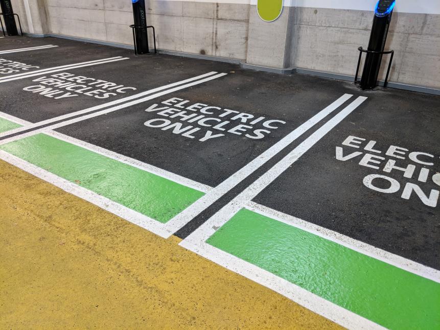 Electric vehicle charging spaces in a multi storey car park.