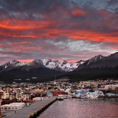 The Port of Ushuaia at sunrise. The view towards the mountains and houses from the pier