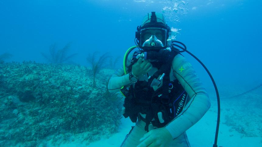 Dr. Riley Elliott dives to the sea floor.