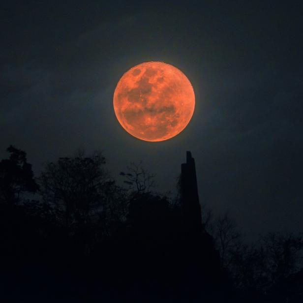 Blood moon full lunar eclipse over mountain in Thailand, Jan 31 2018