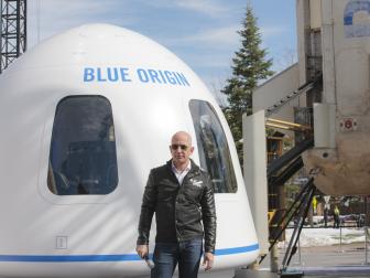 Jeff Bezos, chief executive officer of Amazon.com Inc. and founder of Blue Origin LLC, speaks at the unveiling of the Blue Origin New Shepard system during the Space Symposium in Colorado Springs, Colorado, U.S., on Wednesday, April 5, 2017. Bezos has been reinvesting money he made at Amazon since he started his space exploration company more than a decade ago, and has plans to launch paying tourists into space within two years. Photographer: Matthew Staver/Bloomberg via Getty Images