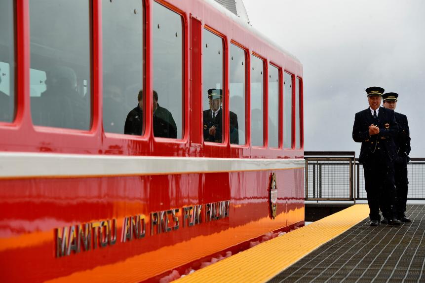 MANITOU SPRINGS, COLORADO - MAY 16: Conductors David Bolser, in front, and Adam Clawson check to make sure all passengers are on board the Broadmoor Manitou and Pikes Peak Cog Railway train before it heads back down Pikes Peak on May 16, 2021 in Manitou Springs, Colorado. Today marked the first day since October 2017 that the almost 130 year old train is making its again way to the summit of Pike Peak. The railway will be opened for four days from May 20th-23rd and again on May 27th when it reopens to the public seven days a week. The train will have five departures a day. The ride takes just over three hours to complete the 8.9 mile ascent and 8.9 mile decent of Pikes Peak. It is the world's highest Cog railway train going up 7,600 feet of vertical gain to the 14,115 foot summit. The train ride takes riders through Pikes Peak's famous pink granite in the Pike National Forest. The railway will celebrate its 130th anniversary at the end of June. (Photo by Helen H. Richardson/MediaNews Group/The Denver Post via Getty Images)
