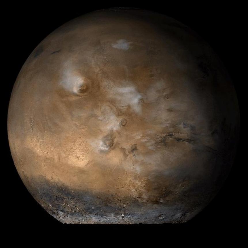 This picture is a composite of Mars Global Surveyor (MGS) Mars Orbiter Camera (MOC) daily global images acquired at Ls 93? during a previous Mars year.of the Tharsis face of Mars