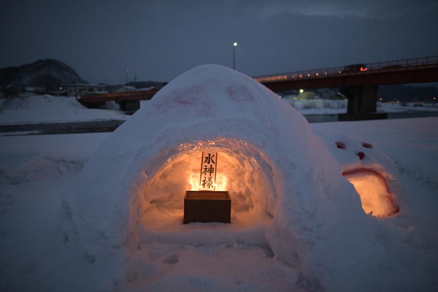 A 'kamakura' snow hut with a candle and altar during the Hiburi Kamakura Festival in Kakunodate town, Semboku, Akita Prefecture, Japan on Feb. 14, 2019. The 400 year old ritual takes place annually on Lunar New Year season to drive away evil spirits from a rice field, to wish for prosperity, avoidance of diseases and also for family safety. Hiburi Kamakura is a traditional New Years event in which participants light a tenpitsu, a bundle of rice ears and swing around their body and creates the fire rings that illuminates the snow-covered park where the event is held..  (Photo by Richard Atrero de Guzman/NurPhoto via Getty Images)