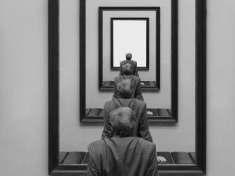 Man in art gallery looking at image of himself, composite image