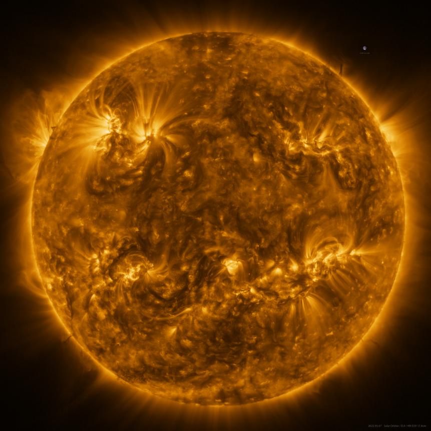 The Sun as seen by Solar Orbiter in extreme ultraviolet light from a distance of roughly 75 million kilometres. The image is a mosaic of 25 individual images taken on 7 March by the high resolution telescope of the Extreme Ultraviolet Imager (EUI) instrument. Taken at a wavelength of 17 nanometers, in the extreme ultraviolet region of the electromagnetic spectrum, this image reveals the Sun’s upper atmosphere, the corona, which has a temperature of around a million degrees Celsius.  In total, the final image contains more than 83 million pixels in a 9148 x 9112 pixel grid, making it the highest resolution image of the Sun’s full disc and outer atmosphere, the corona, ever taken.  An image of Earth is also included for scale, at the 2 o’clock position.