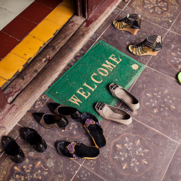 A pile of shoes on the ground at Quan Su Pagoda in Hanoi, Vietnam.