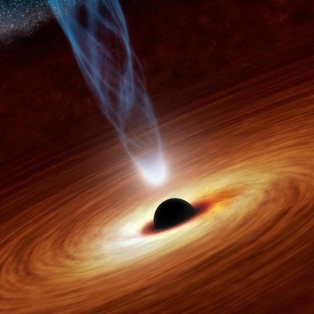 This artist's concept illustrates a supermassive black hole with millions to billions times the mass of our sun. Supermassive black holes are enormously dense objects buried at the hearts of galaxies.