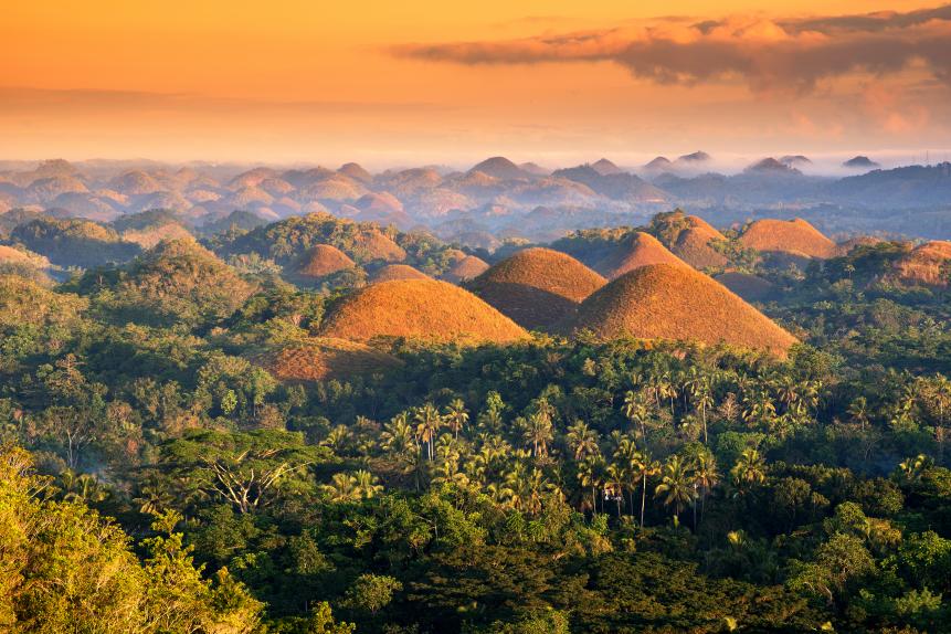 The Chocolate Hills are a unique geological formation in the Bohol, Philippines. Taken during sunset.