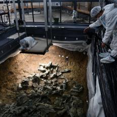 GUANGHAN, CHINA - AUGUST 08: An archaeologist works at No. 8 sacrificial pit of the Sanxingdui Ruins site on August 8, 2022 in Guanghan, Deyang City, Sichuan Province of China. (Photo by Zhang Lang/China News Service via Getty Images)
