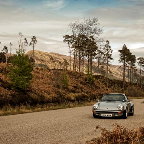 SCOTLAND, UNITED KINGDOM:  Porsche 911 Turbo classic car driving on the North Coast 500 route the Scottish highlands United Kingdom.  (Photo by Martyn Goddard/Corbis via Getty Images)